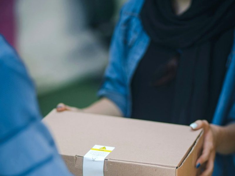 Handing over a carefully packed PrintMyTrack shipment